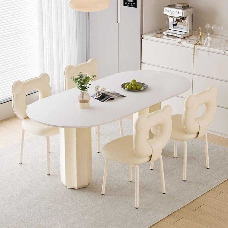 Cream Style Dining Table with Stone Top and Compact Elegant Chairs for Home Kitchen.