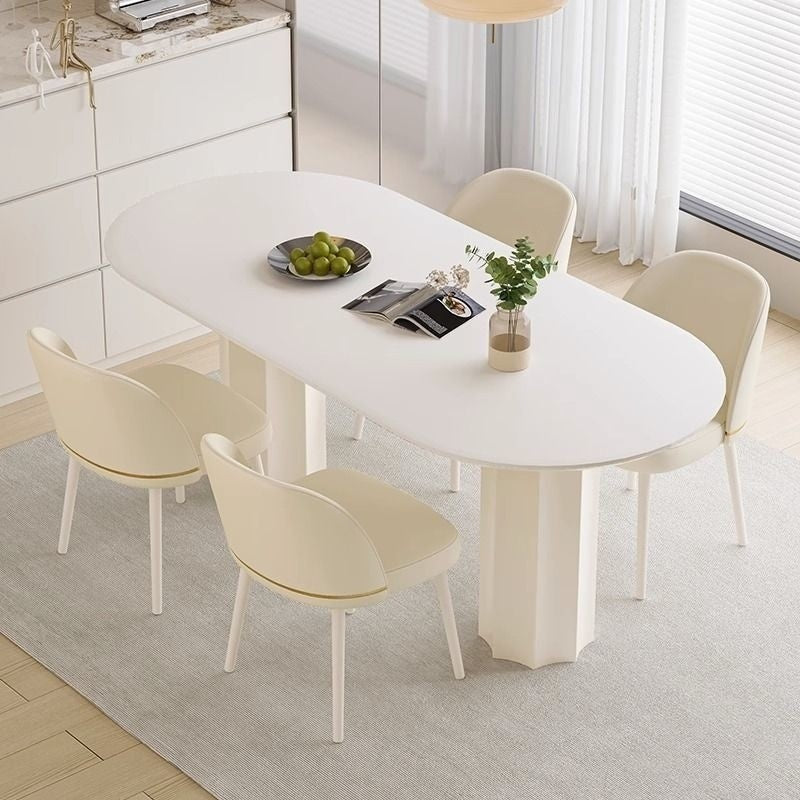 Cream Style Dining Table with Stone Top and Compact Elegant Chairs for Home Kitchen.