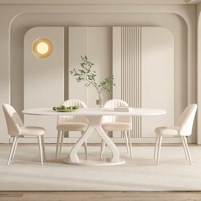 Luxurious French style minimalist stone table and chairs combination, high-end cream marble dining table, suitable for modern small families.