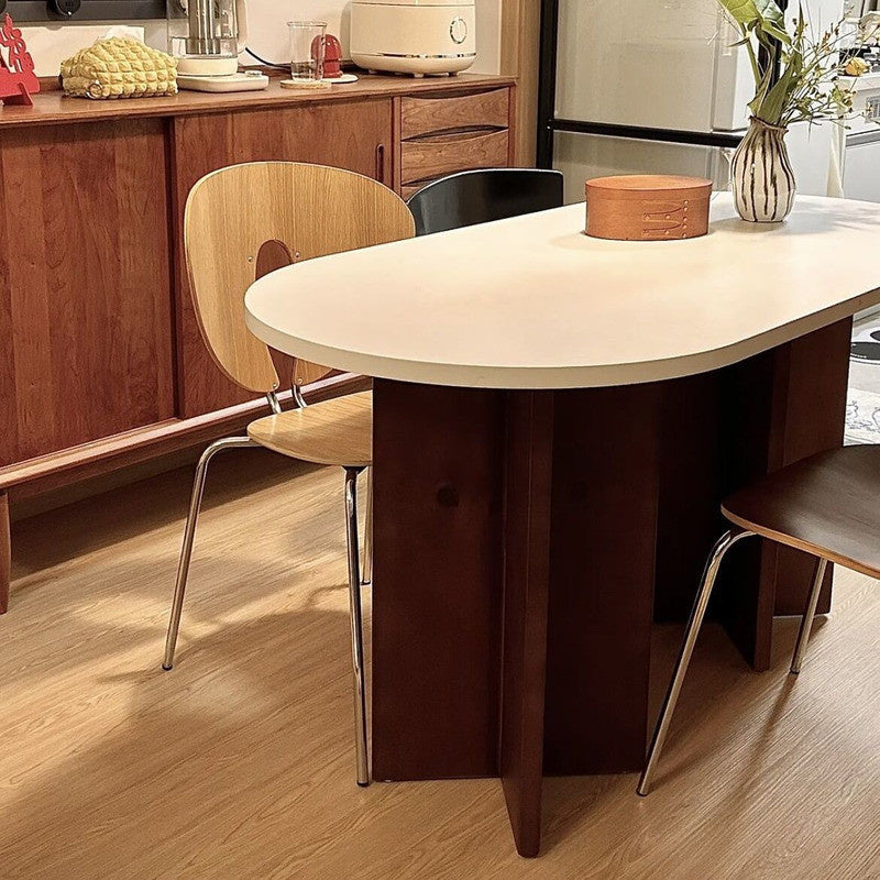 French-Nordic Style Oval Dining Table Set Simple and chic wooden table with chairs, suitable for small spaces.