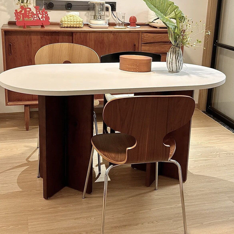 French-Nordic Style Oval Dining Table Set Simple and chic wooden table with chairs, suitable for small spaces.