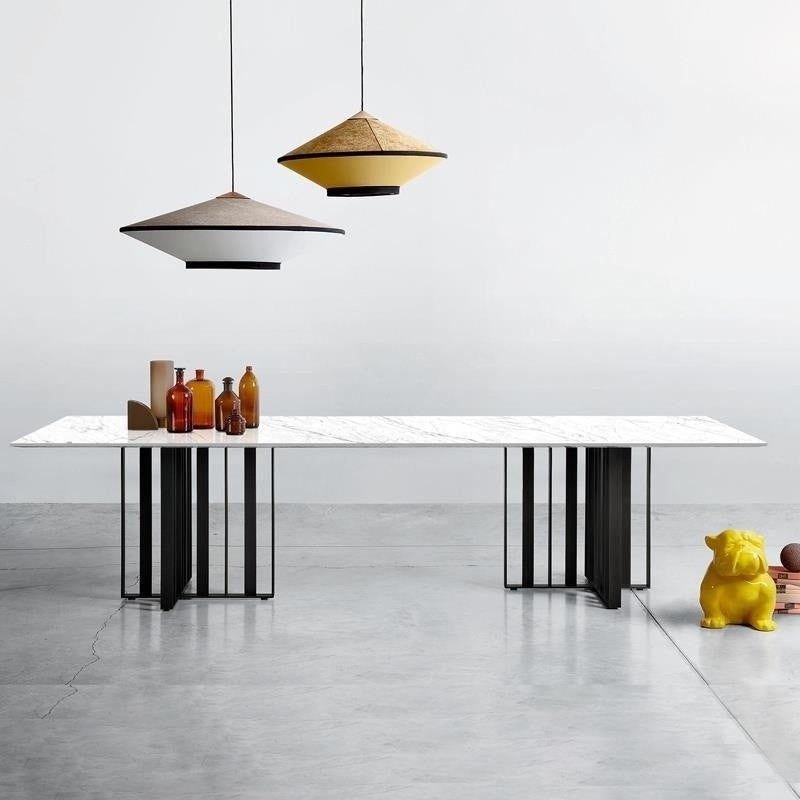 Premium dining table made of Italian laminate stone, specially designed for modern square style villas.