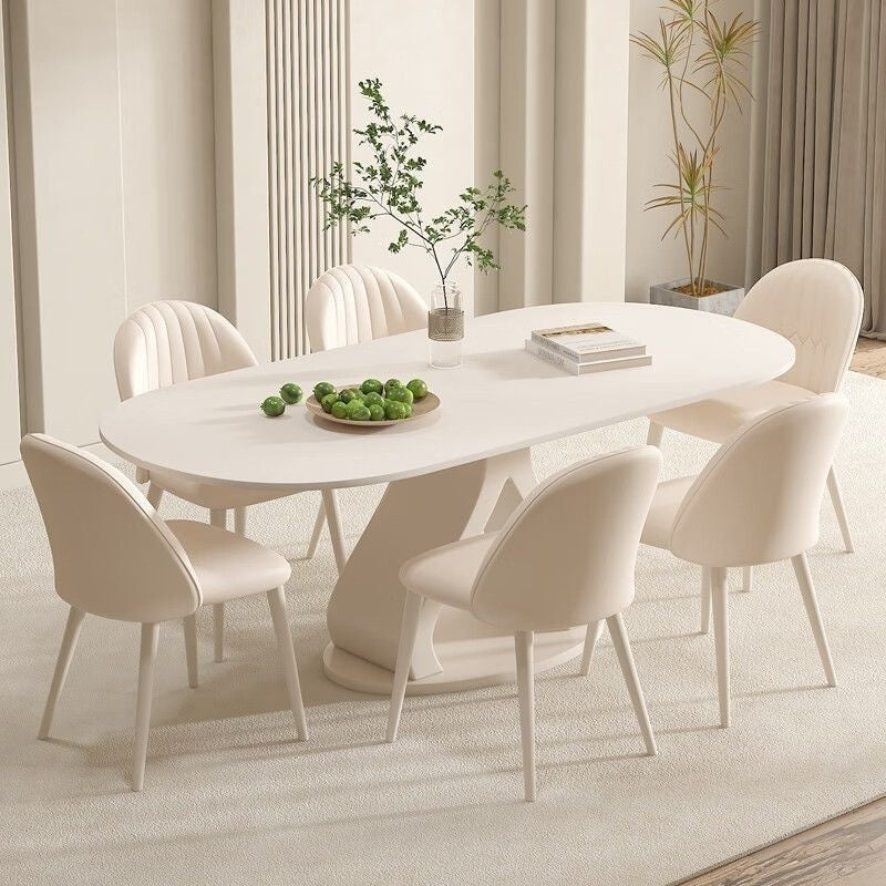 Luxurious French style minimalist stone table and chairs combination, high-end cream marble dining table, suitable for modern small families.