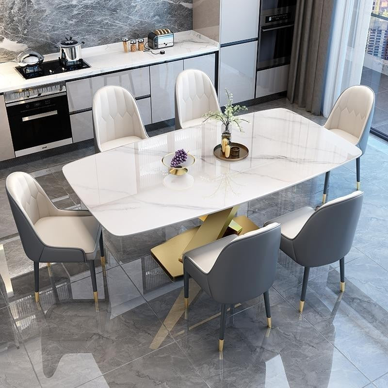 Italian dining table, luxurious, smooth surface, small artificial stone slab. Suitable for condos, stainless steel base, durable, modern.
