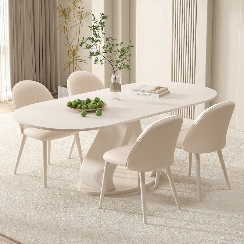 Luxurious French style minimalist stone table and chairs combination, high-end cream marble dining table, suitable for modern small families.