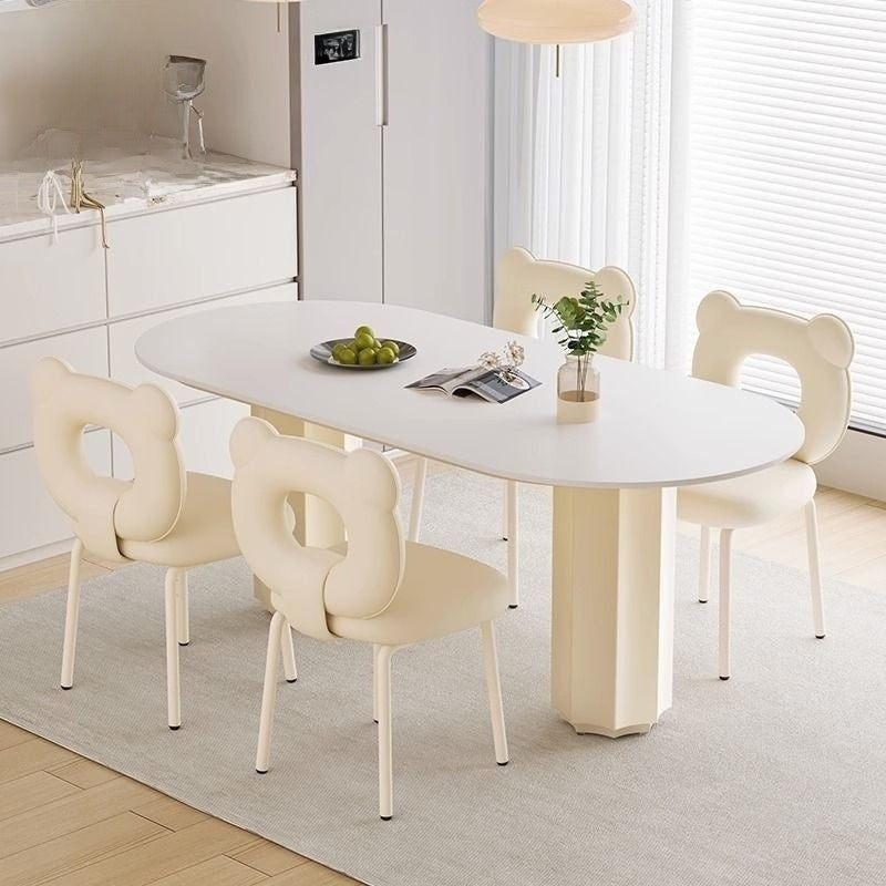 Cream Style Dining Table with Stone Top and Compact Elegant Chairs for Home Kitchen.