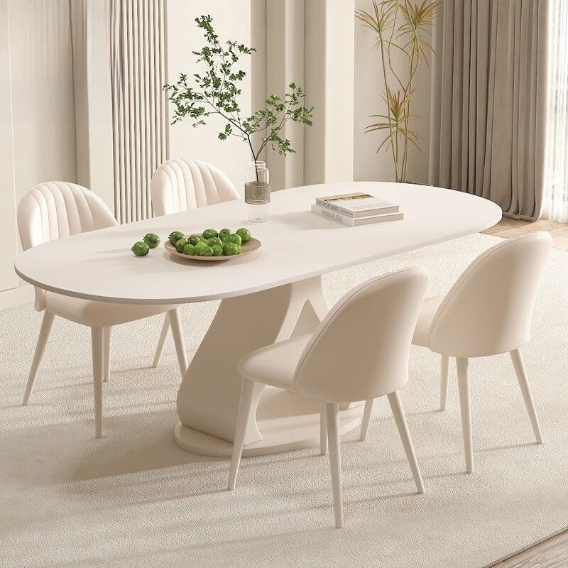 Luxurious French style minimalist stone table and chairs combination, high-end cream marble dining table, suitable for modern small families.