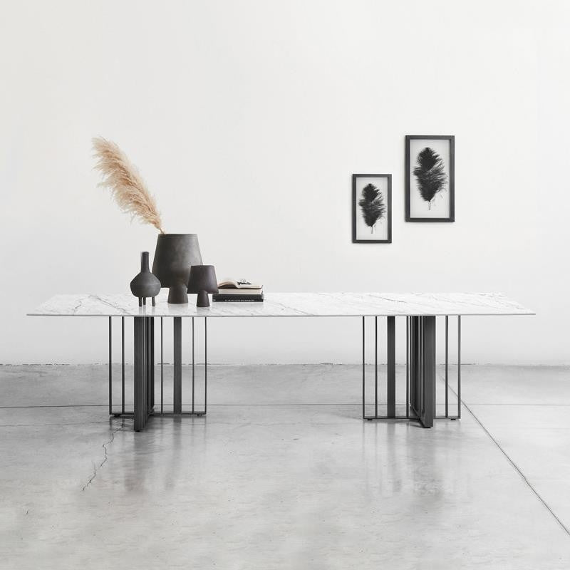 Premium dining table made of Italian laminate stone, specially designed for modern square style villas.